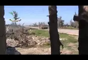 Free Syrian Army Fighter Throws A Grenade Down A Tank Barrel