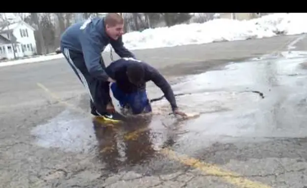 Kid Jumps Into A Puddle
